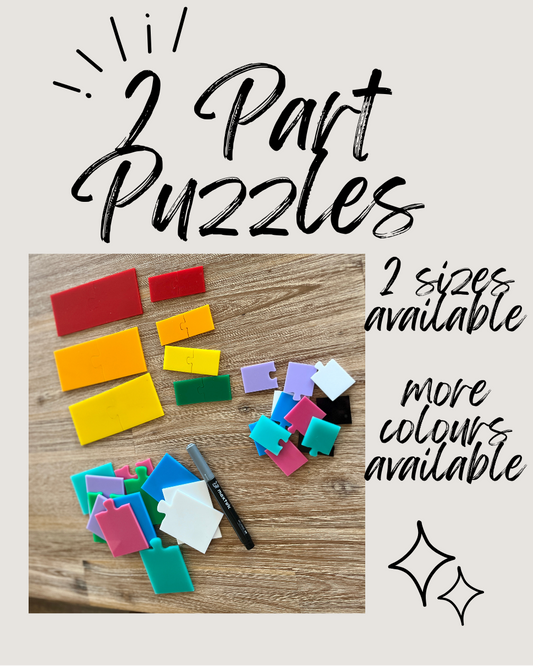 Assorted colorful two-piece puzzle shapes in large and small sizes arranged on a wooden surface with a black marker, Little Dry Erasables - 2 Part Puzzles; 2 Sizes Available, handcrafted, homeschool, education resources.