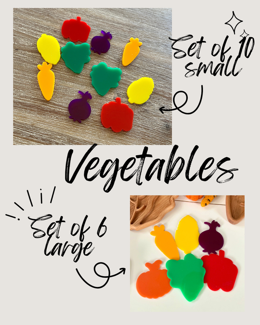 Ten small and six large colorful vegetable shapes in red, green, yellow, orange, and purple arranged on wooden and white surfaces, Little Dry Erasables - Harvest Vegetables, handcrafted, homeschool, education resources.