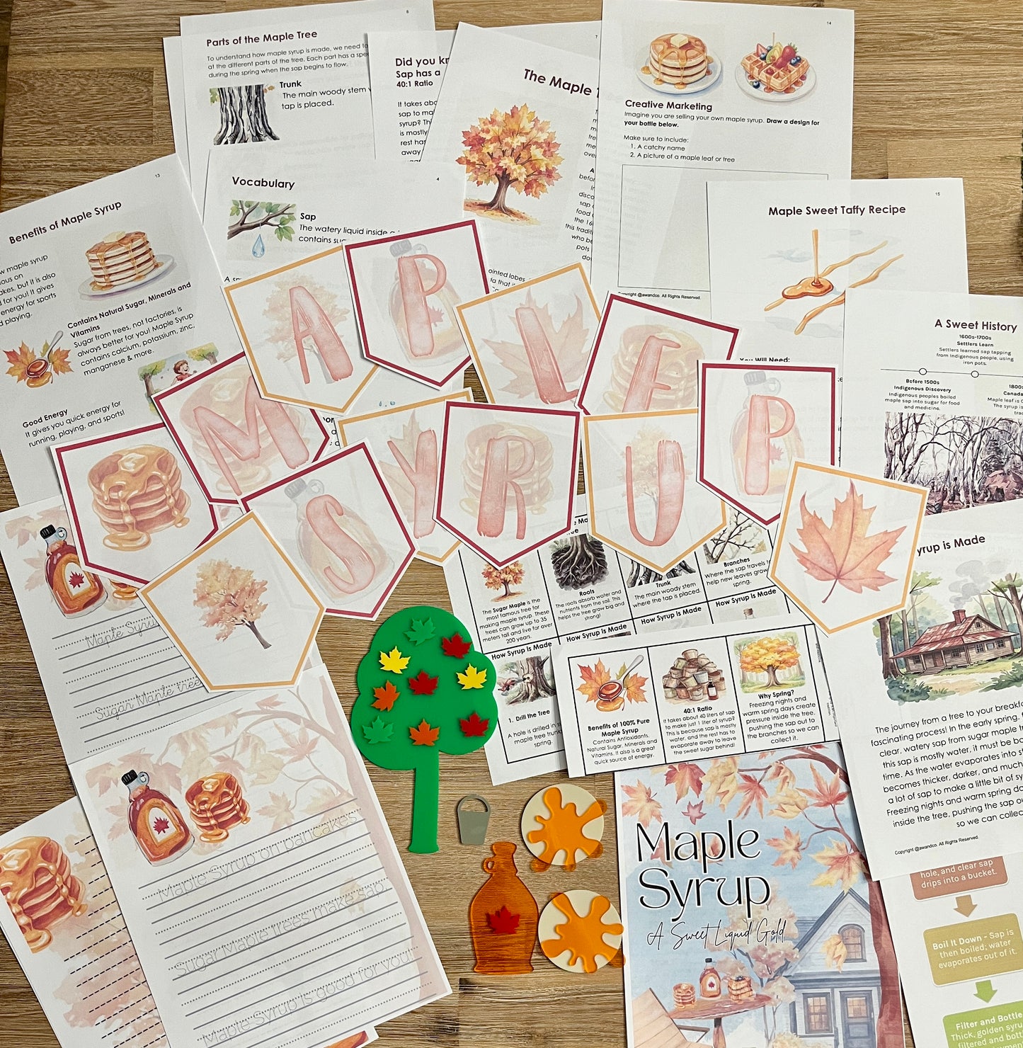 Digital Download | Maple Syrup Unit Study showcasing printable pages with maple syrup facts, vocabulary, recipes, educational cutouts of bottles, leaves, and trees arranged on a wooden surface, handcrafted homeschool education resources.