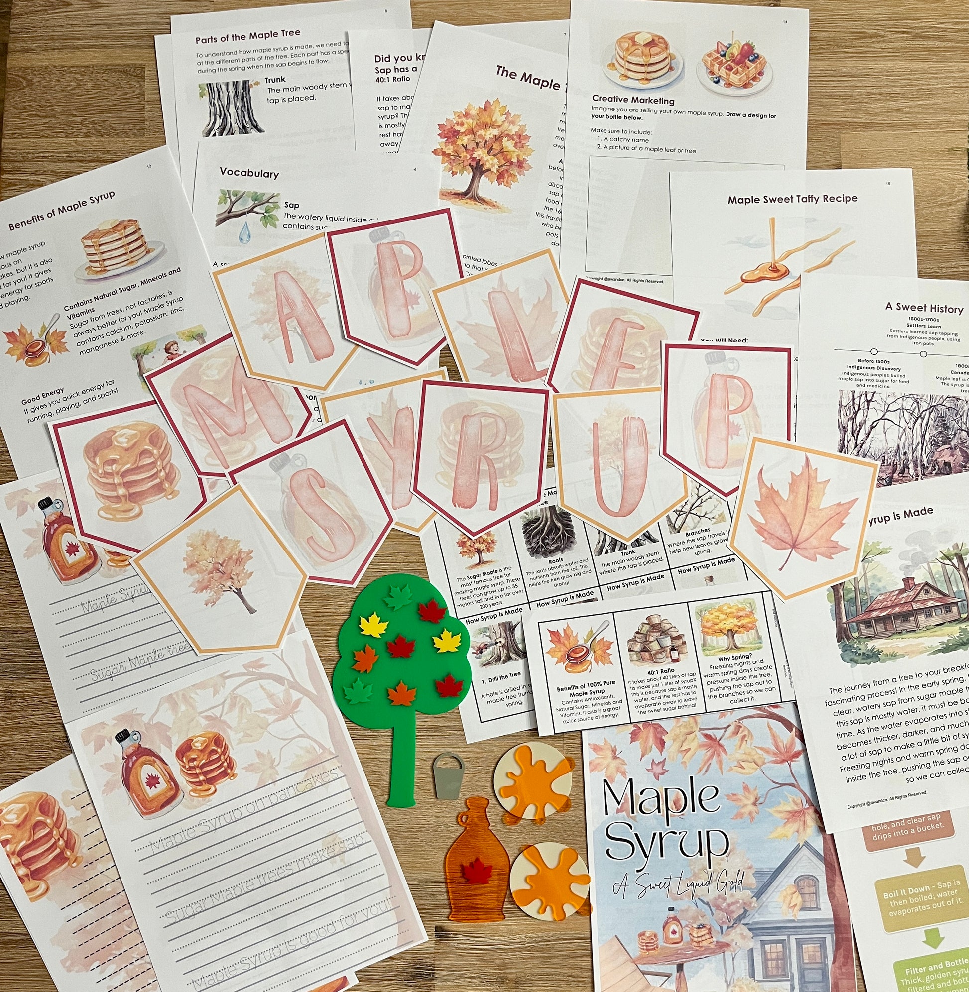 Digital Download | Maple Syrup Unit Study showcasing printable pages with maple syrup facts, vocabulary, recipes, educational cutouts of bottles, leaves, and trees arranged on a wooden surface, handcrafted homeschool education resources.