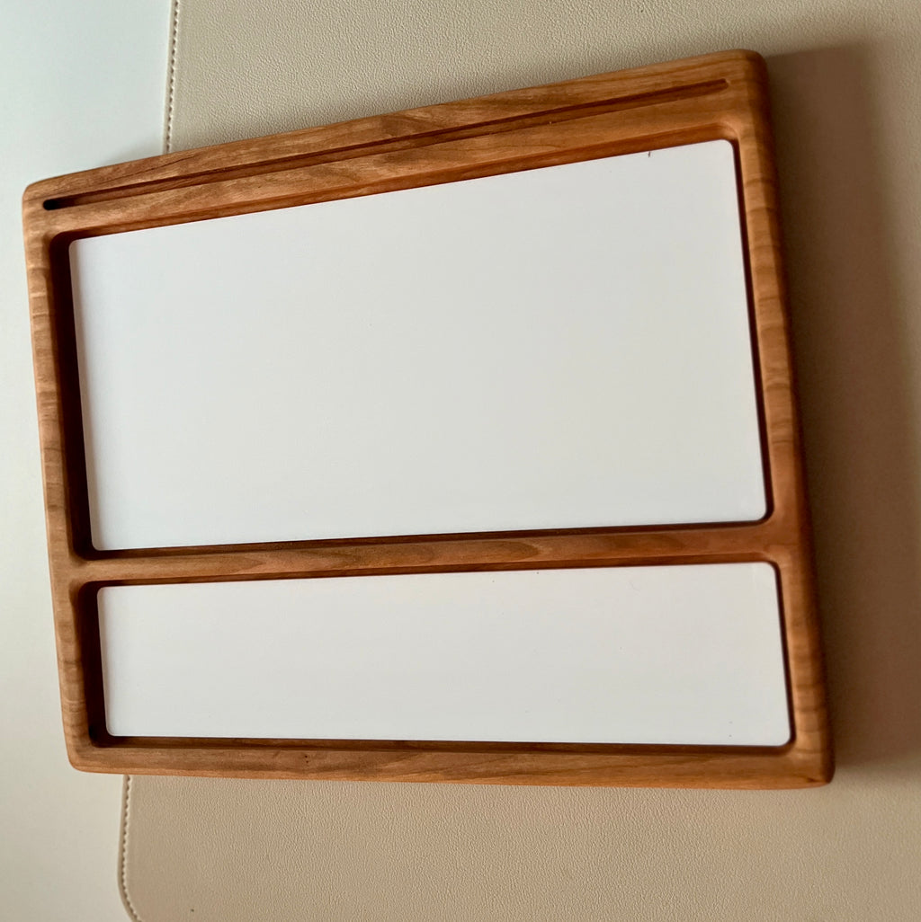 Smaller wooden multipurpose sensory tray with two white dry erase inserts, one large and one narrow on wood surface