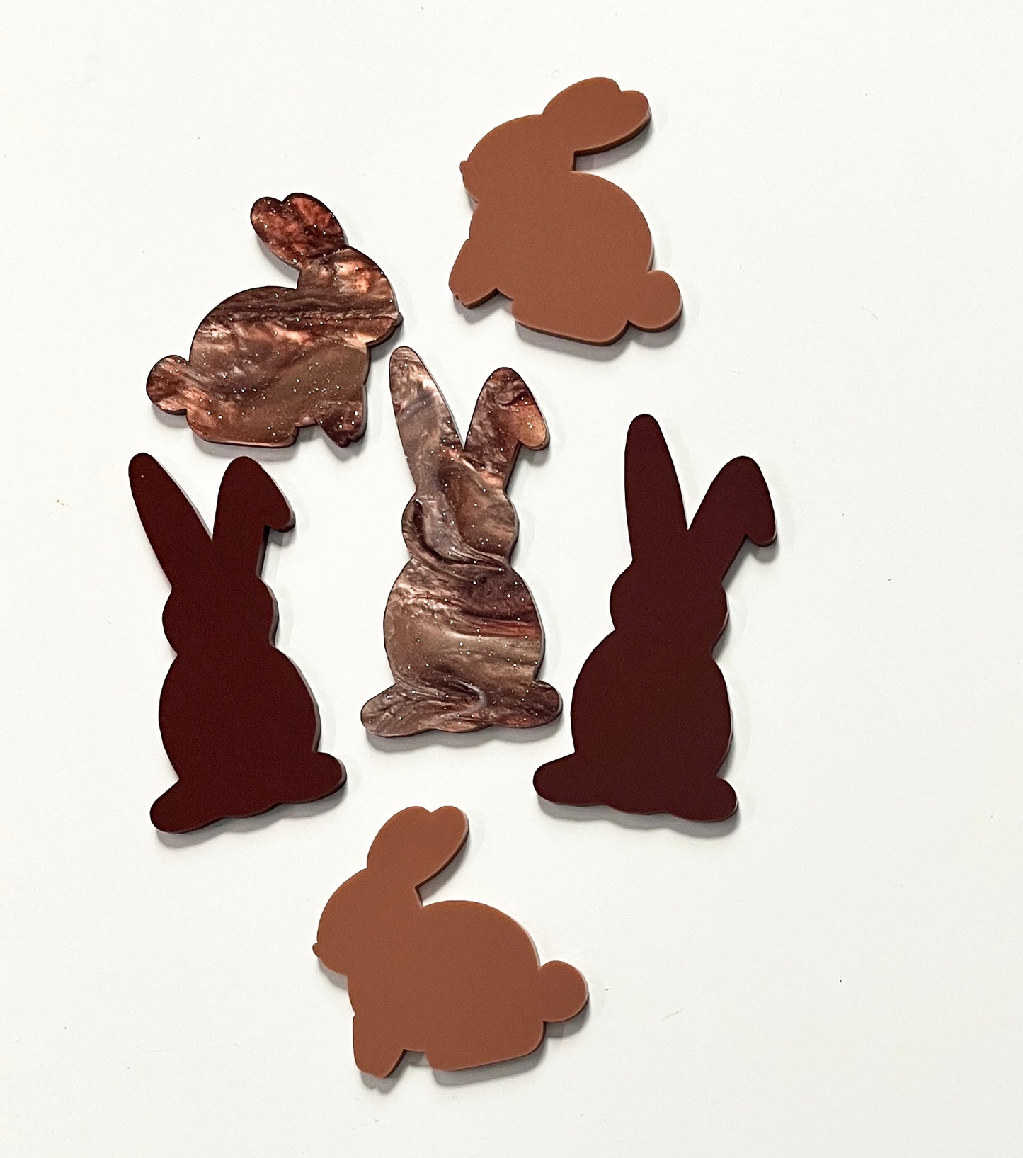 Set of brown bunny-shaped dry erase shapes on a white background