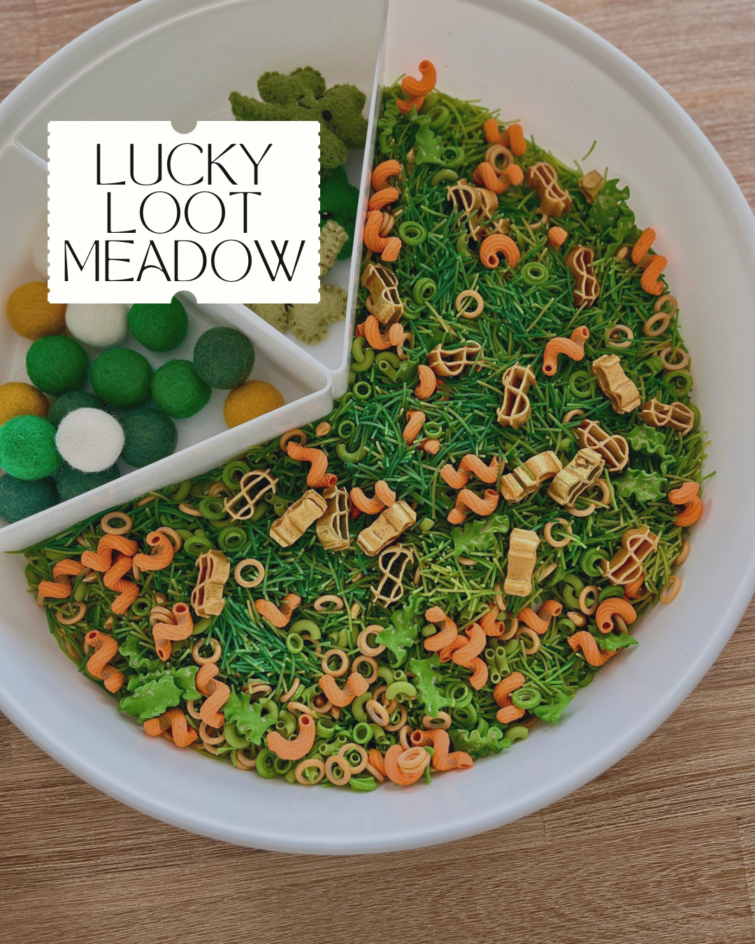 Limited Edition Lucky Loot Meadow Sensory Filler | St Patrick’s Day featuring a divided white tray with green, white, and yellow felt balls and a mix of green and orange textured sensory pieces on a wooden surface, handcrafted homeschool educational resources.