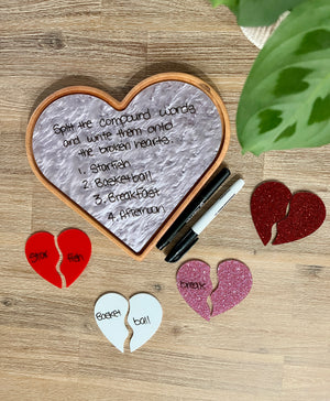 Large Heart Plate / Sensory Tray with a marbled dry erase surface showing a compound word activity, surrounded by colorful broken heart pieces with words, black and white markers, handcrafted homeschool education resources.