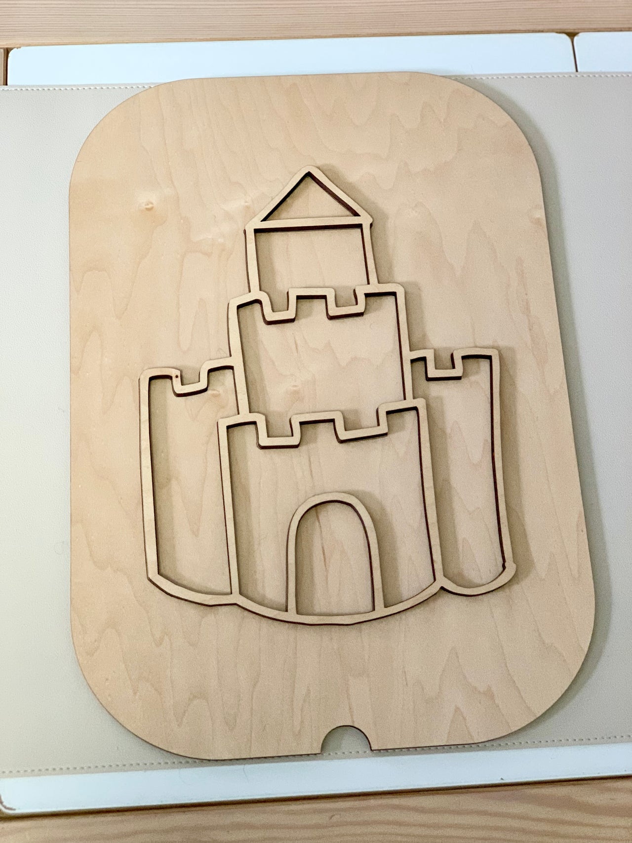 Maple plywood Fillable Castle Flisat table top insert with castle cutout design on light wood surface