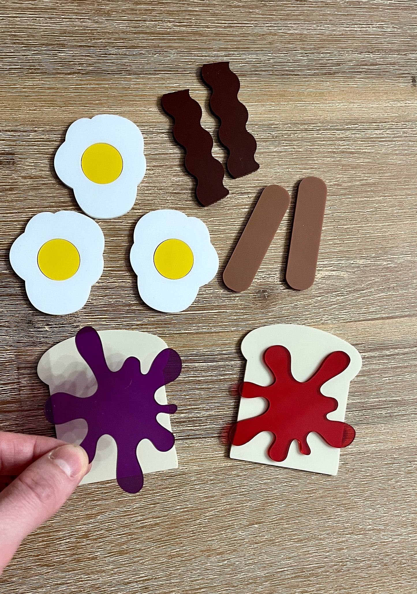 Little Dry Erasables - Breakfast Toast with Jam, Bacon, Sausage and Eggs showing handcrafted wooden play pieces of fried eggs, bacon strips, sausages, toast with colorful jam, homeschool educational resources.