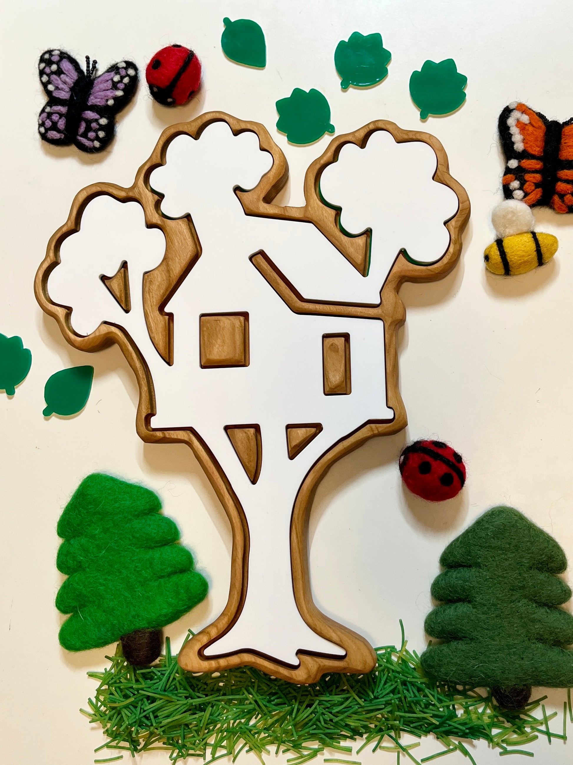 Wooden tree house shaped wooden tray with decorative elements on a white background