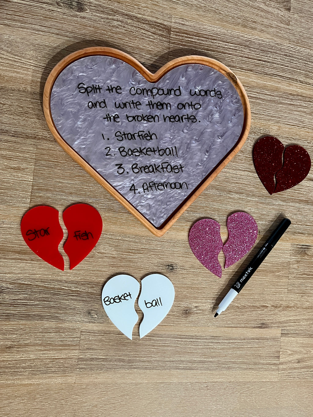 Large Heart Plate / Sensory Tray with a marbled dry erase surface displaying compound word activity instructions, surrounded by colorful broken heart pieces with words and a dry erase marker, handcrafted homeschool education resources.