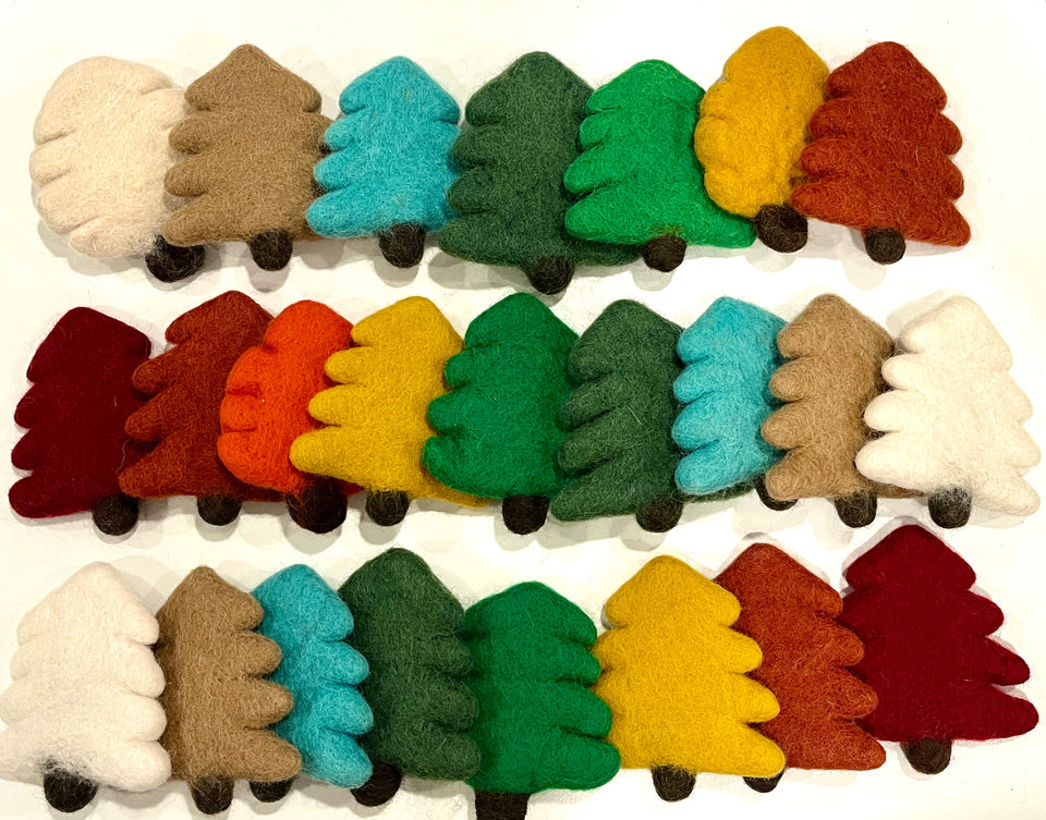 Rows of colorful felt Christmas tree shapes in red, green, yellow, blue, brown, and white with small brown trunks on white background