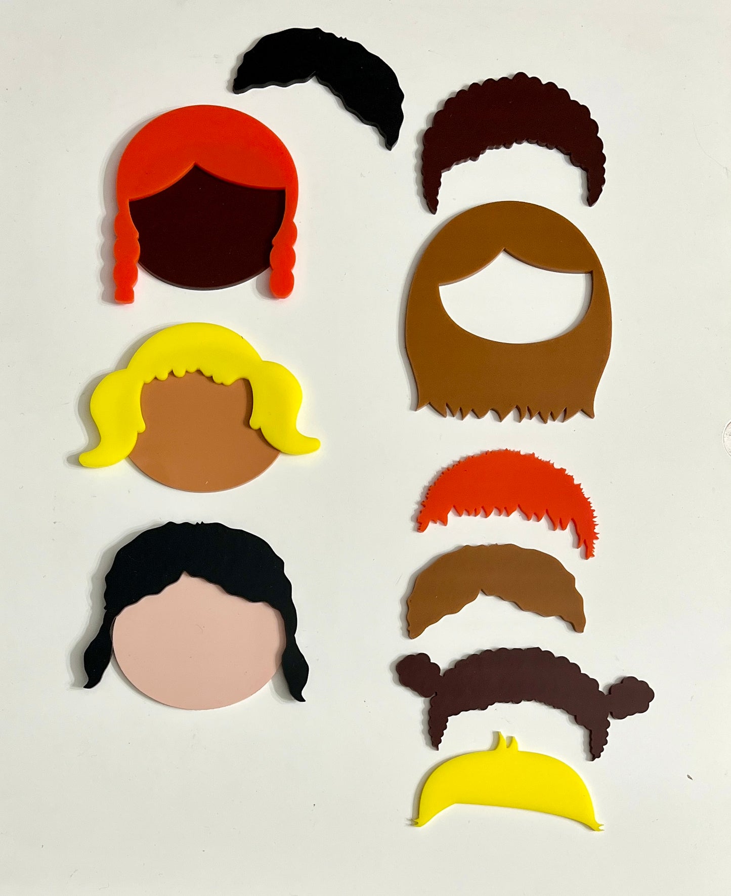 Dry erase face pieces with interchangeable hair for creative play and learning about emotions