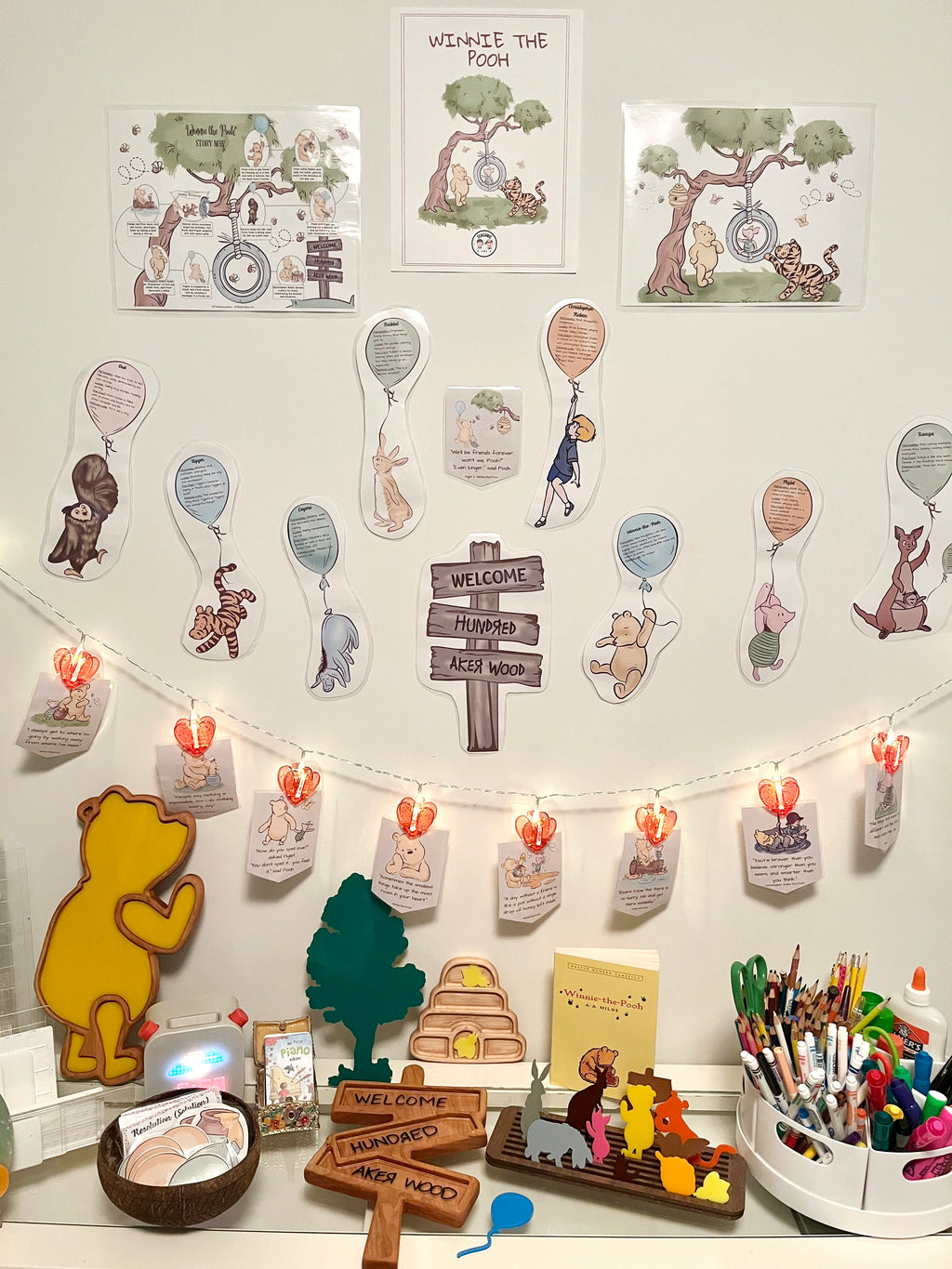 Winnie the Pooh Plate / Sensory Tray - Two sizes available with handcrafted wood accessories arranged on a homeschool desk featuring character cutouts, welcome signs, and sensory filler pieces designed for creative educational resources.