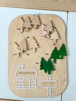 Wooden Flisat insert with maple plywood and green acrylic Christmas tree pieces plus hot chocolate and North Pole signs