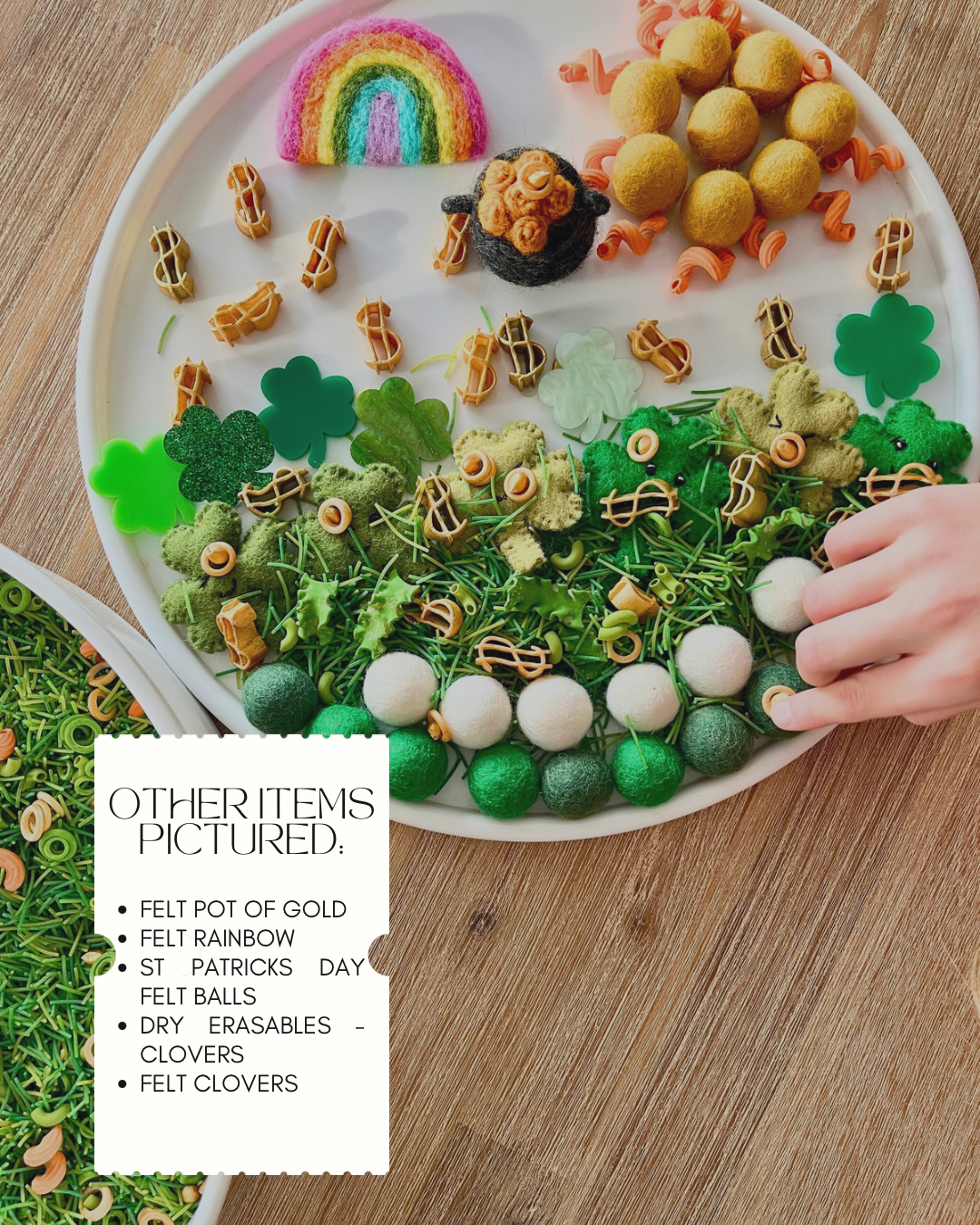 Limited Edition Lucky Loot Meadow Sensory Filler | St Patrick’s Day featuring a white divided tray with green, yellow, and white felt balls, felt shamrocks, rainbow, pot of gold, and musical note accents arranged on a wood surface, handcrafted homeschool education resources.