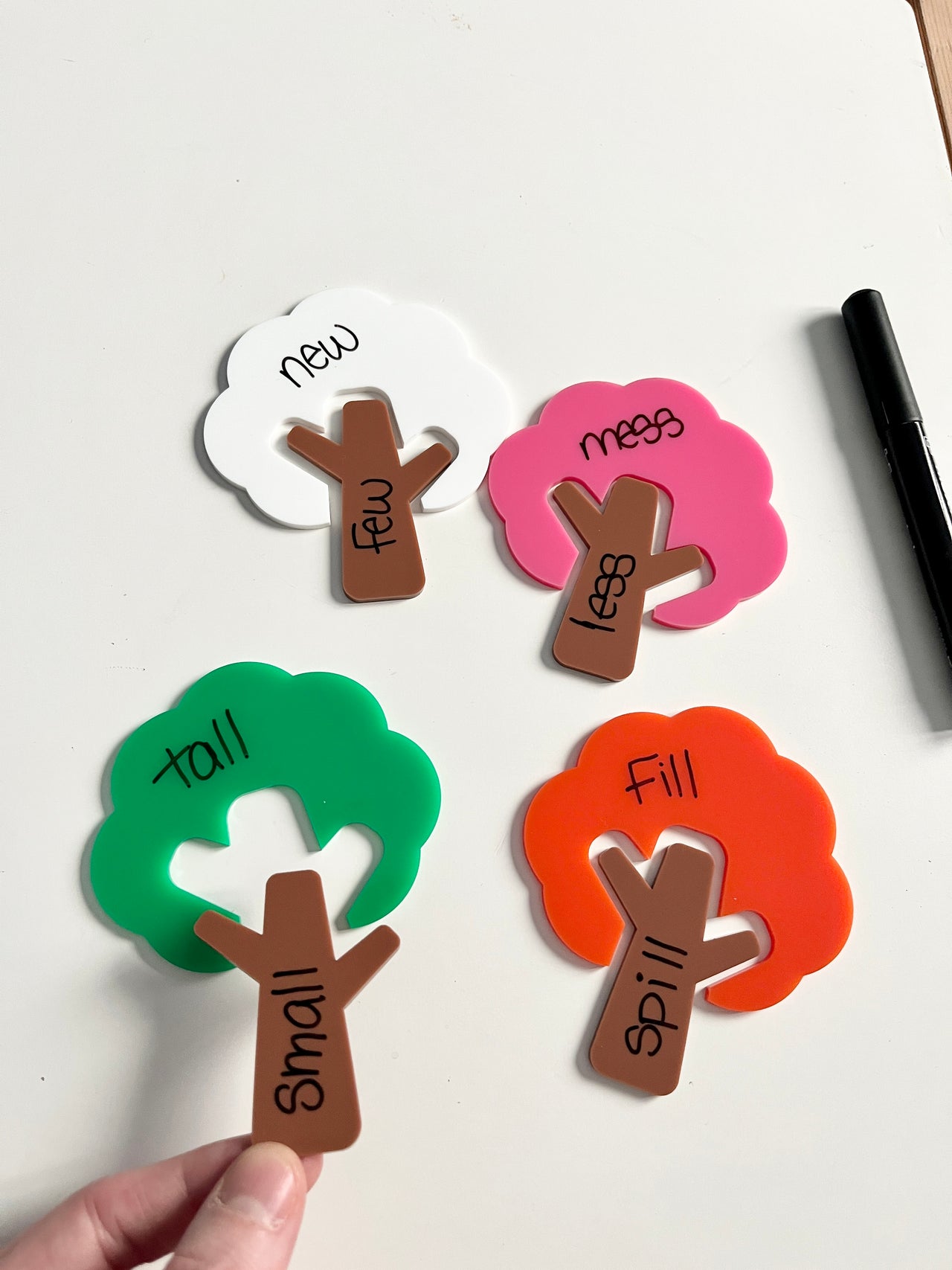 Little Dry Erasables — Trees and Tree Trunks — Colours of Seasons; Medium Version showing colorful tree shapes in green, pink, orange, and white with brown trunks featuring handwritten opposites and a black dry-erase marker, handcrafted homeschool education resources.