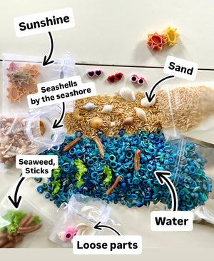 Assorted small shells, beads, pasta, and sticks arranged to resemble a beach scene with labeled clear pouches