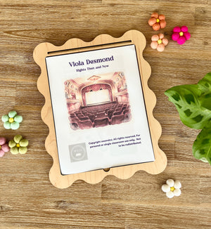 Digital Download | Viola Desmond Mini Study displayed on a scalloped wooden tray surrounded by colorful felt flowers and a green plant leaf, handcrafted homeschool education resources.