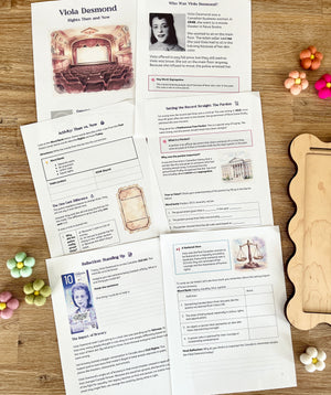 Digital Download | Viola Desmond Mini Study laid out on a wooden surface alongside colorful felt flower decorations and a wood tray, handcrafted homeschool education resources.