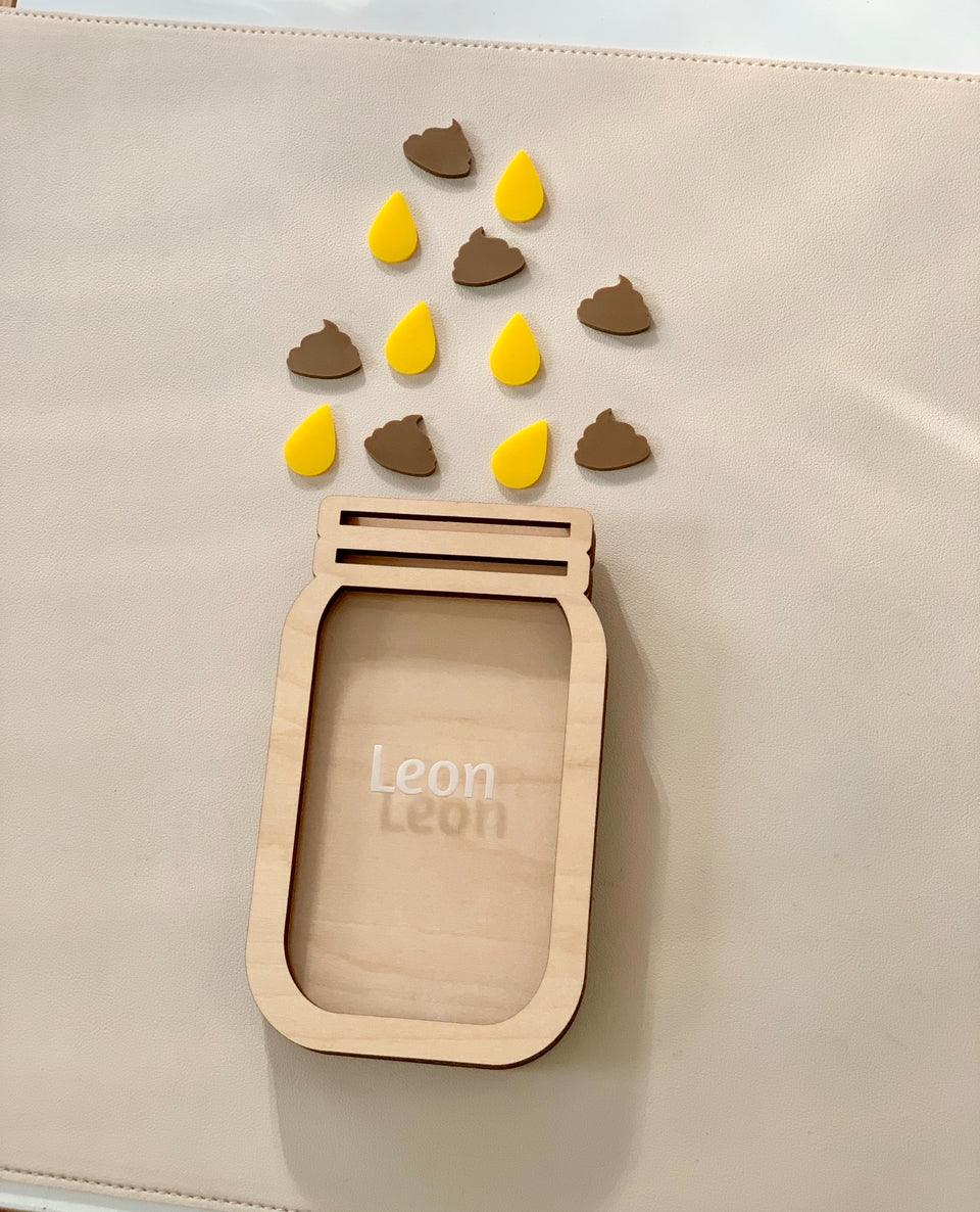 Personalized wooden reward jar with name Leon surrounded by yellow and brown wooden tokens on beige surface