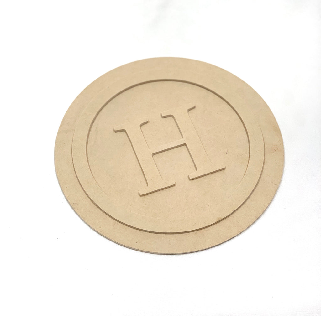 Round 3D monogram wooden sign with raised letter H on double-layer unfinished MDF surface