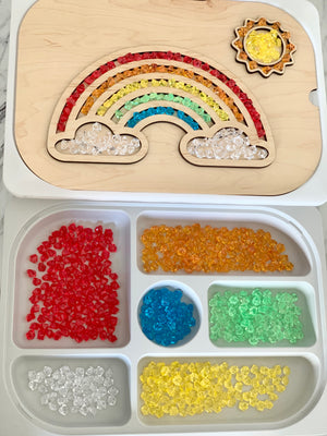 Maple plywood fillable rainbow Flisat table top insert with colorful acrylic gems in tray compartments on white surface