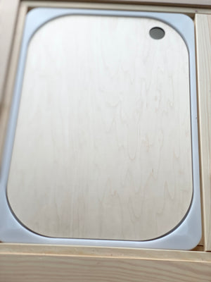Natural wood Flisat table bin lid with smooth rounded corners and finger hole detail on light wood background