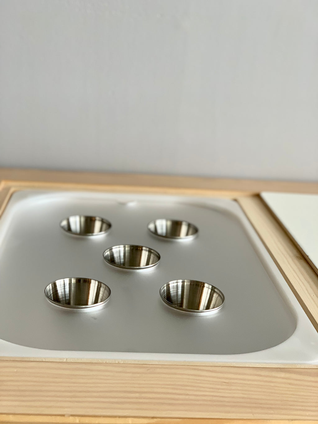 Maple plywood Tinker Pot Flisat tabletop insert with five removable stainless steel metal cups on white surface