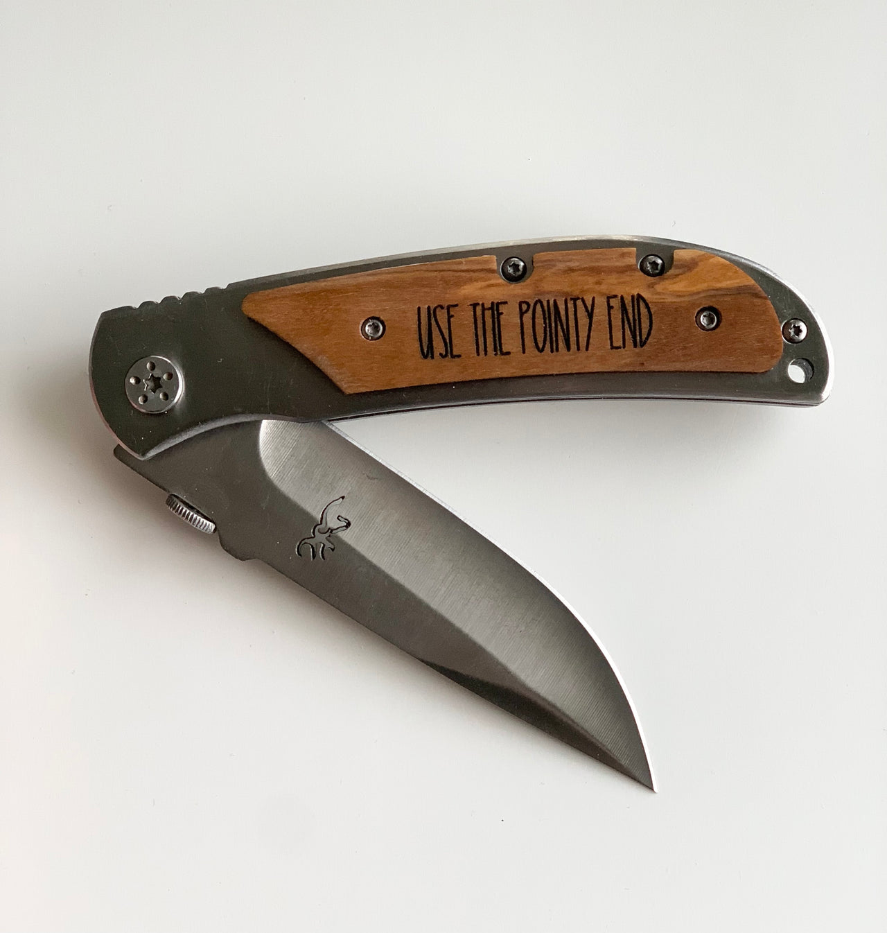 Custom wooden pocket knife with stainless steel blade and wooden handle engraved with "USE THE POINTY END" text