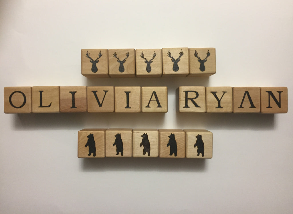 Customizable 2-inch wooden blocks with letters and animal silhouettes, personalized for names Olivia and Ryan.
