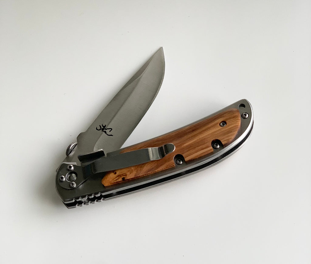 Folded custom wooden pocket knife with stainless steel blade and natural wood handle on white background
