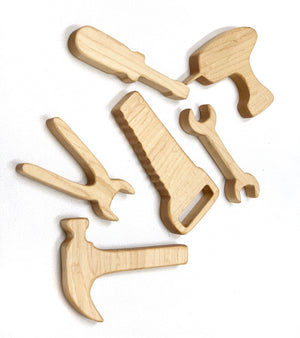 Set of six natural wooden toy tools including hammer, saw, wrench, pliers, screwdriver, and drill on white background