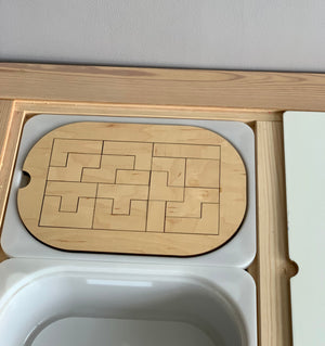 Small wooden puzzle insert with interlocking pieces designed to fit Trofast Flisat bins tabletop slot