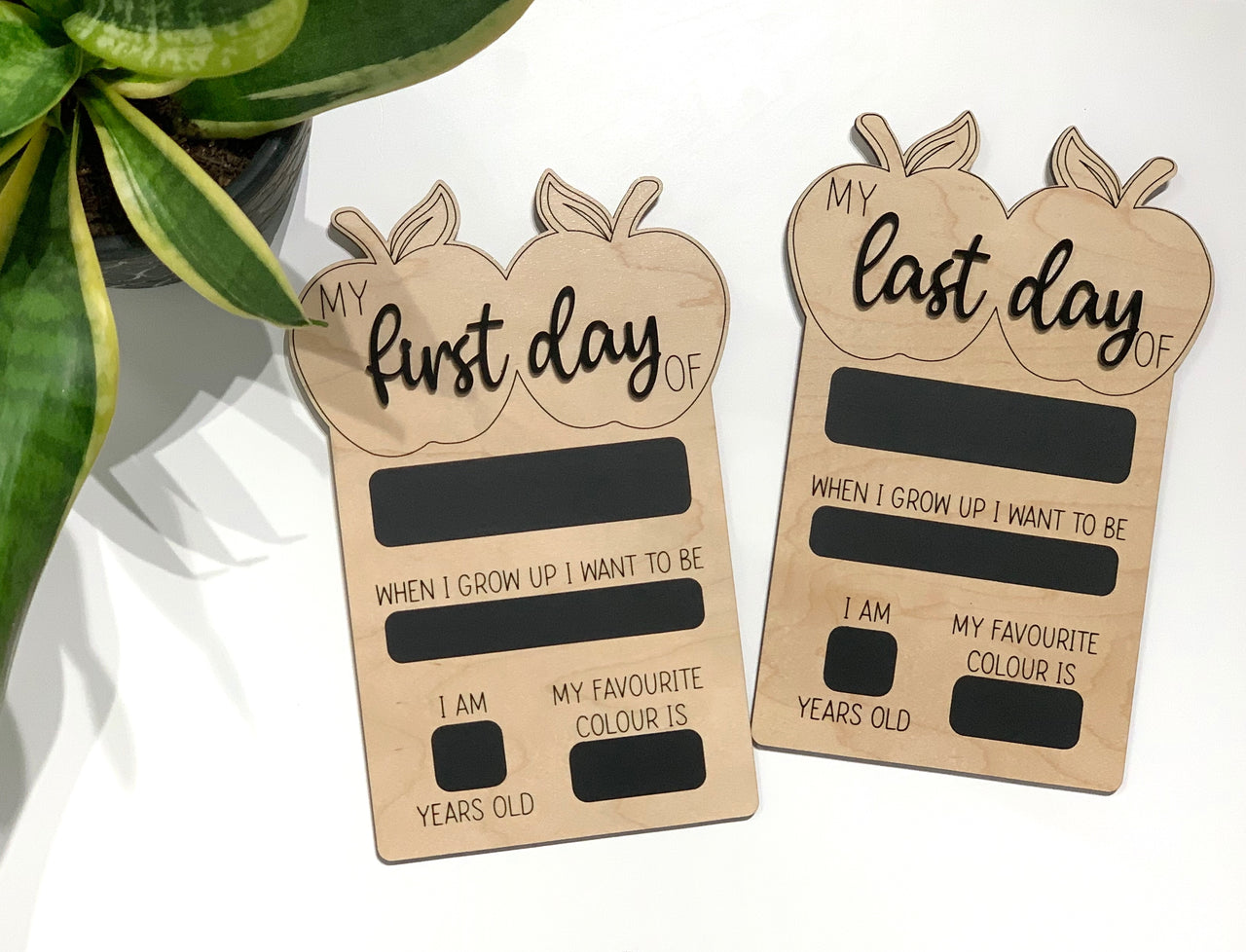 Reversible wooden first and last day of school chalkboard sign props with apple shapes and fill-in sections on white background