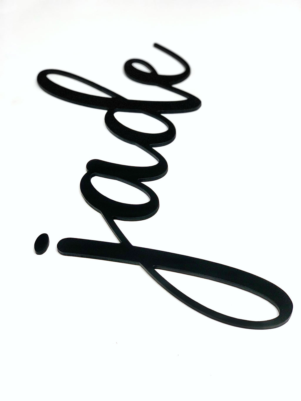 Black custom word cutout in cursive script spelling "jade" on white background with smooth edges