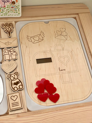 Set of seven red acrylic heart shapes on wooden tray with engraved mailbox and love-themed illustrations